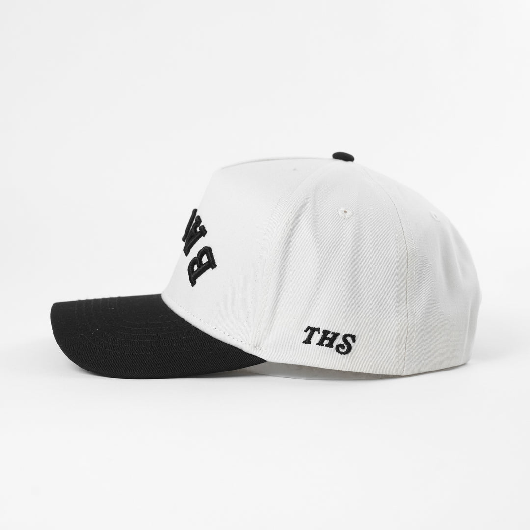 White and black cap with 'THS' text on the side