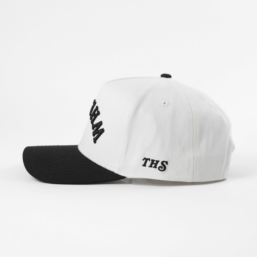 whiskey upside down a-frame snapback hat with THS logo on the side