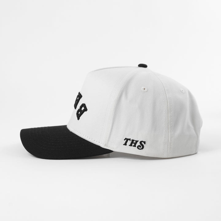 White and black cap with 'THS' branding