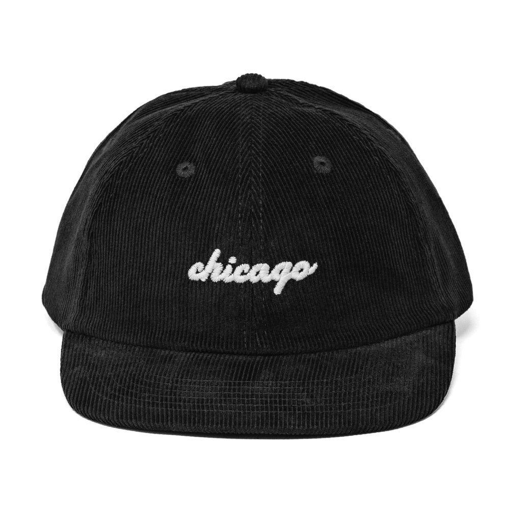 Black corduroy snapback cap with 'chicago' embroidery on a white background