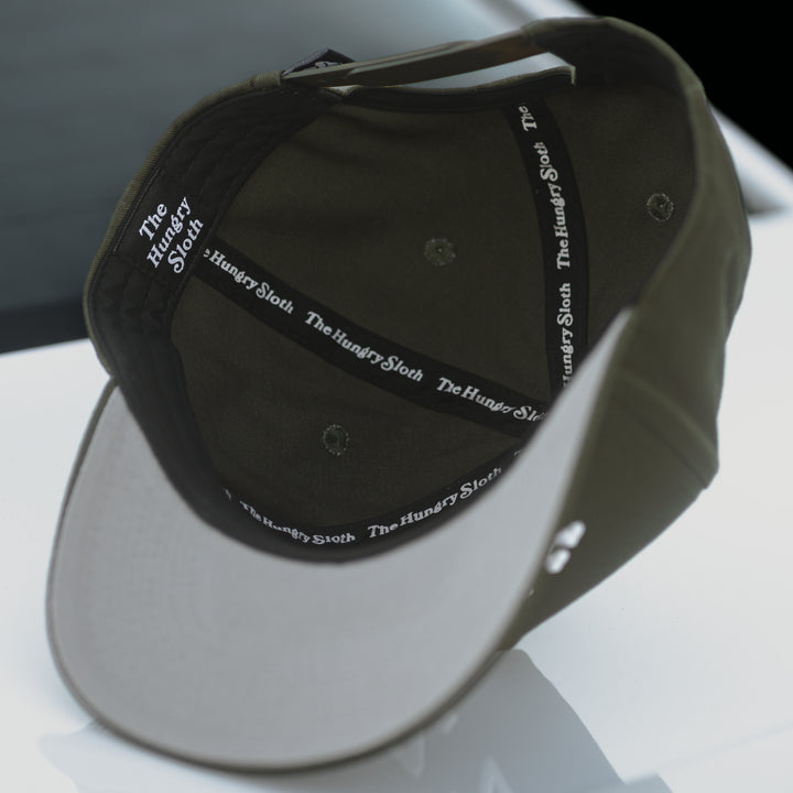 snapback hat olive green with The Hungry Sloth branding underneath