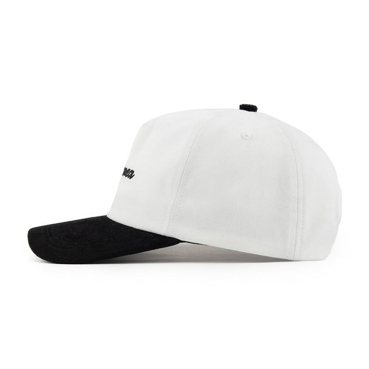 white and black unstructured cap