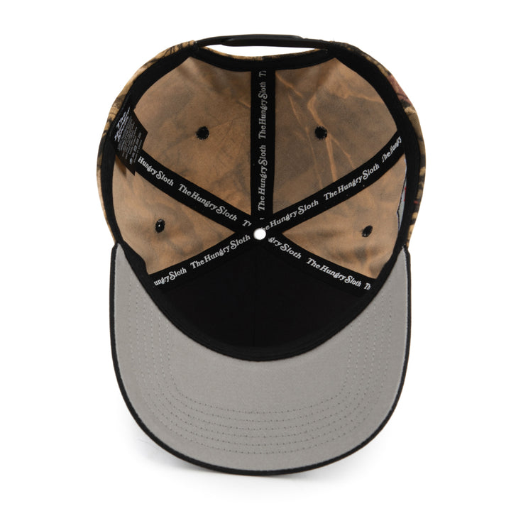 snapback hat with the hungry sloth branding on the bottom