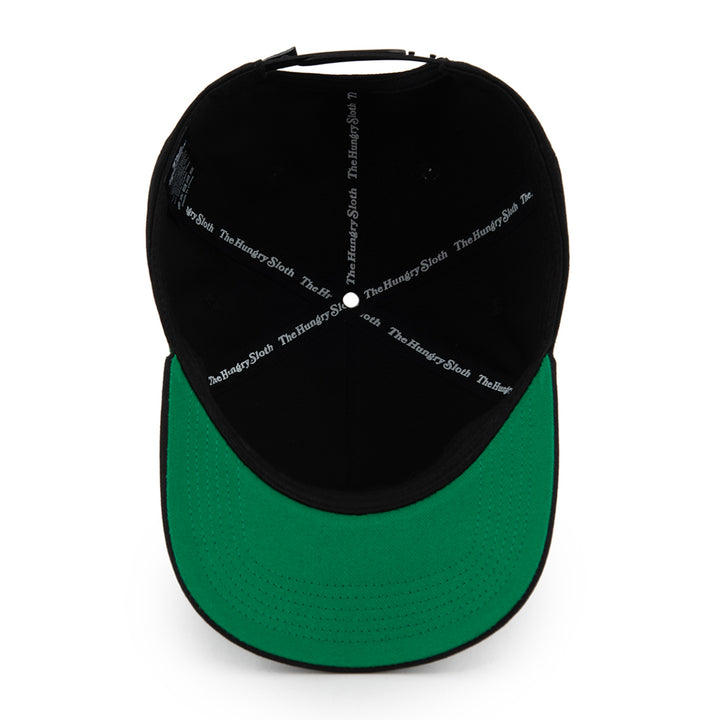 Black cap with green undervisor with The Hungry Sloth branding underneath