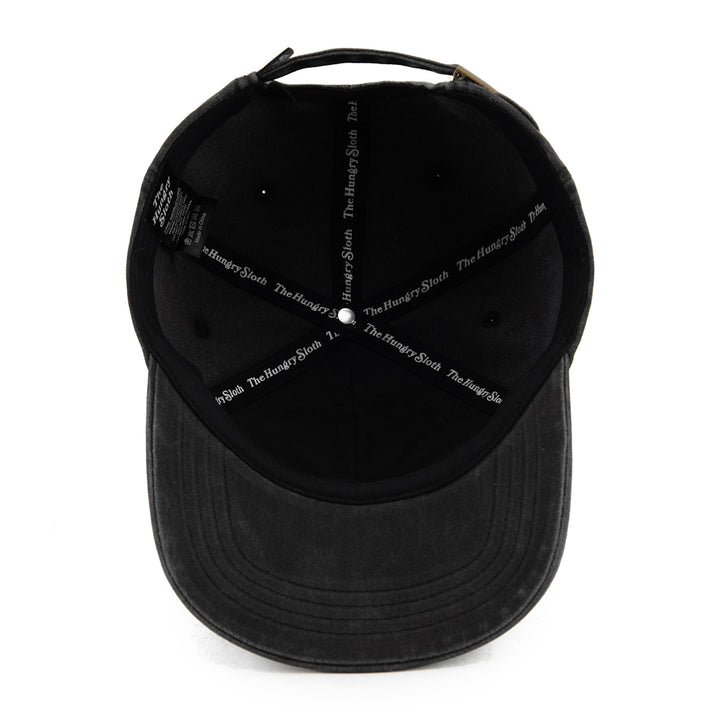 vintage black dad hat with the hungry sloth branding underneath