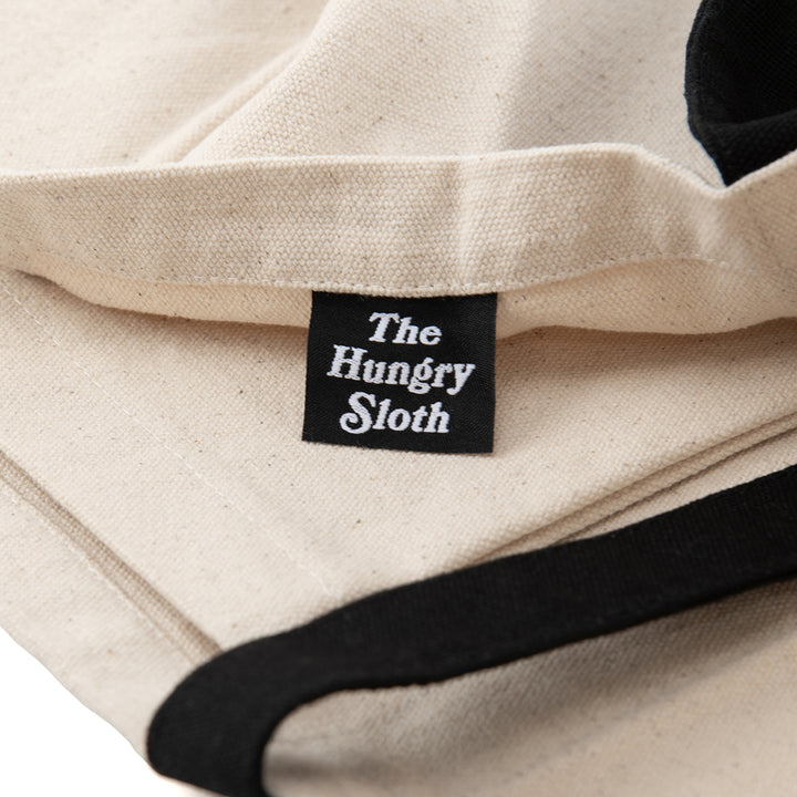 the hungry sloth tote bag
