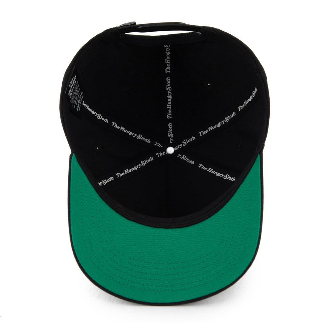 black snapback hat from the underneath with the hungry sloth branding and green undervisor