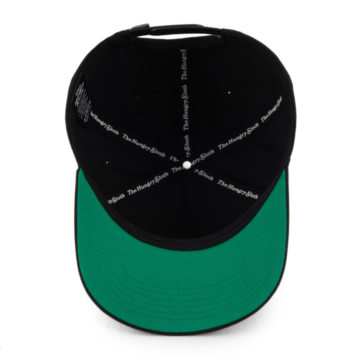 black snapback hat from the underneath with the hungry sloth branding and green undervisor