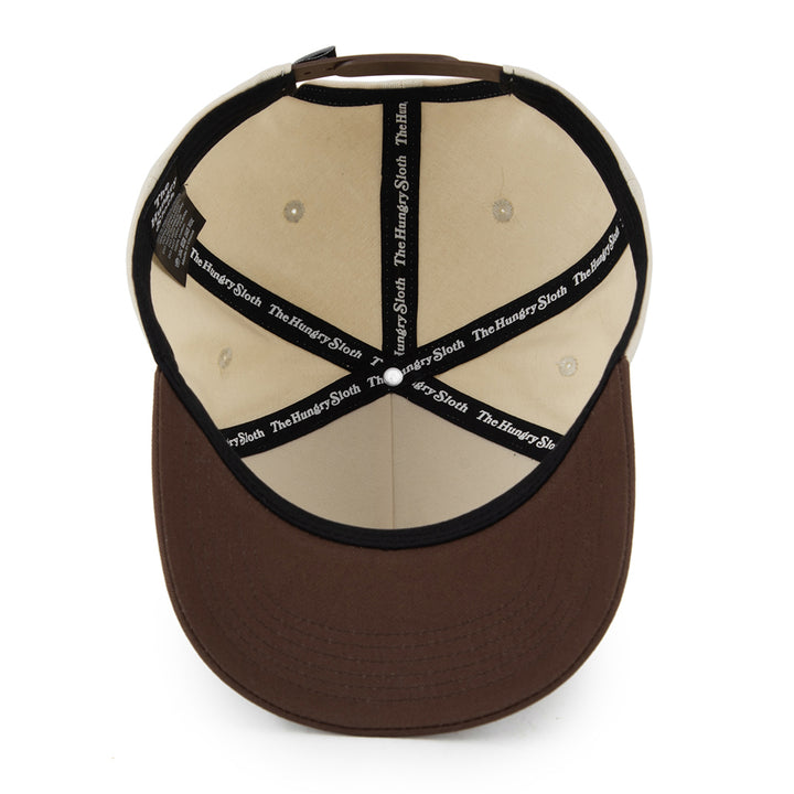natural and brown snapback hat with the hungry sloth branding underneath