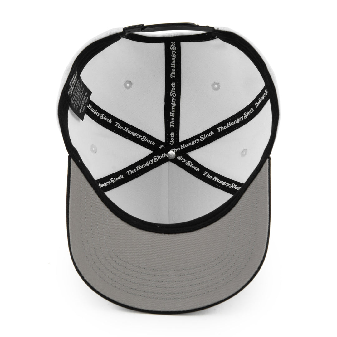 white and black snapback hat from the bottom angle with the hungry sloth branding and a grey undervisor