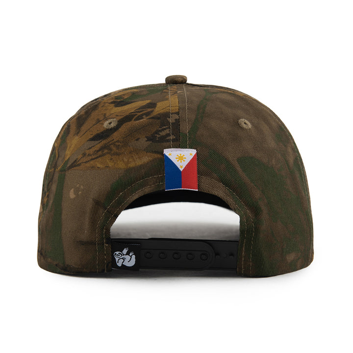 tree camo snapback hat with Philippines flag label on the back and sloth logo tag