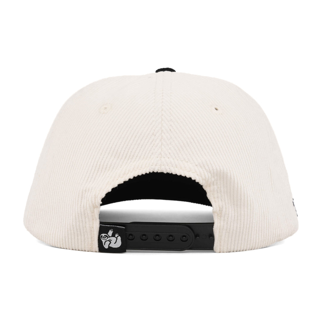 white and black corduroy snapback hat with the hungry sloth label on the back