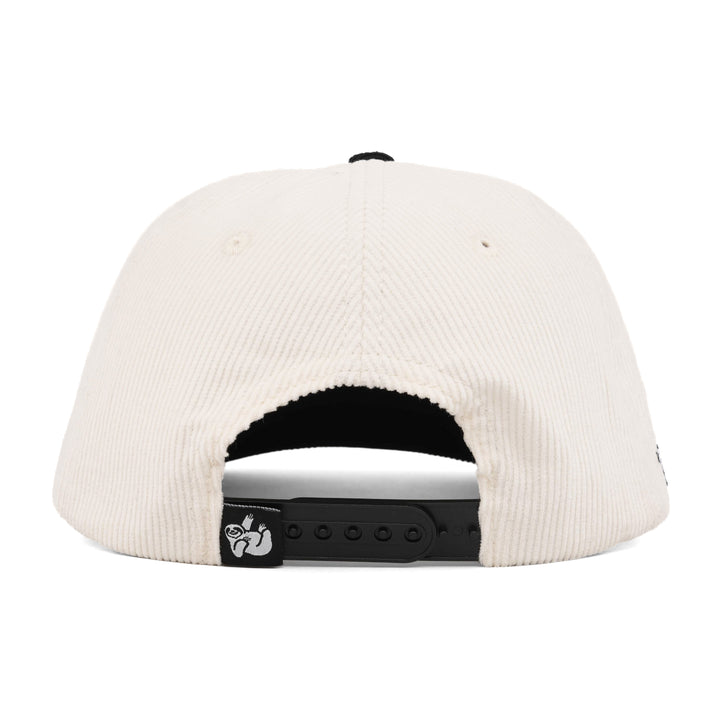 white and black corduroy snapback hat with the hungry sloth label on the back