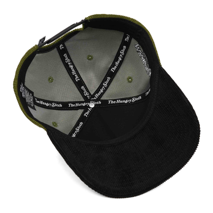 green and black corduroy snapback hat with the hungry sloth branding underneath