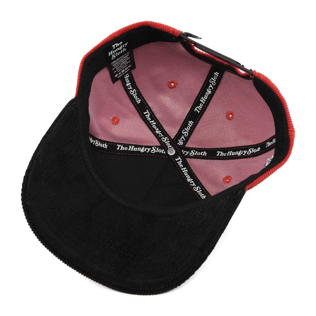 red and black corduroy snapback hat with the hungry sloth branding underneath