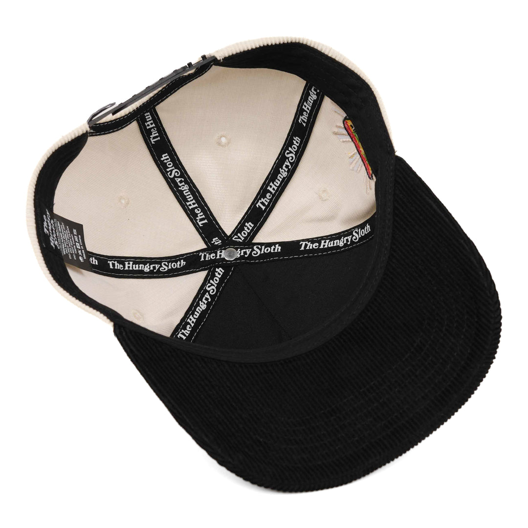 off-white and black corduroy snapback hat with the hungry sloth branding underneath