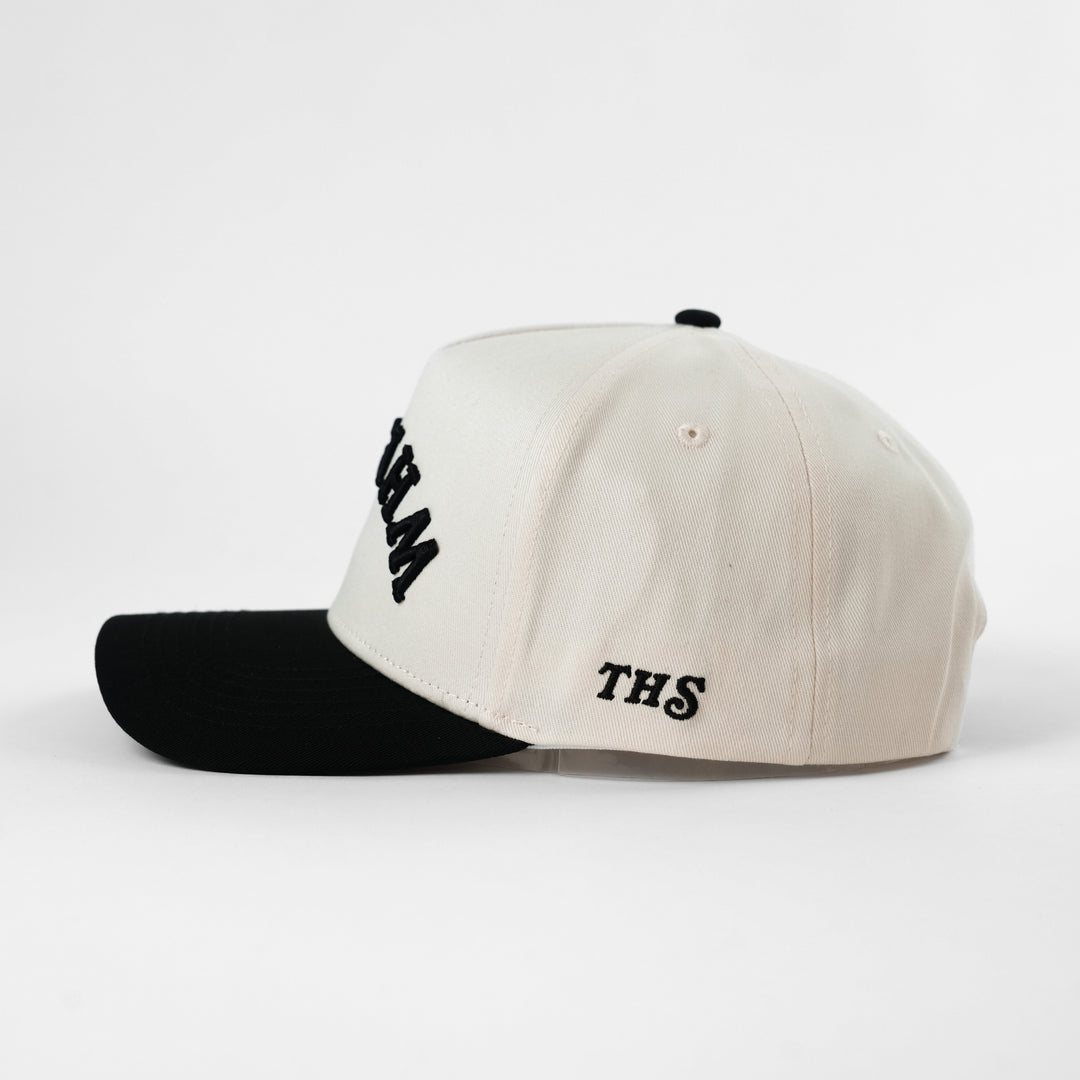 upside down whiskey snapback hat with THS branding on the side